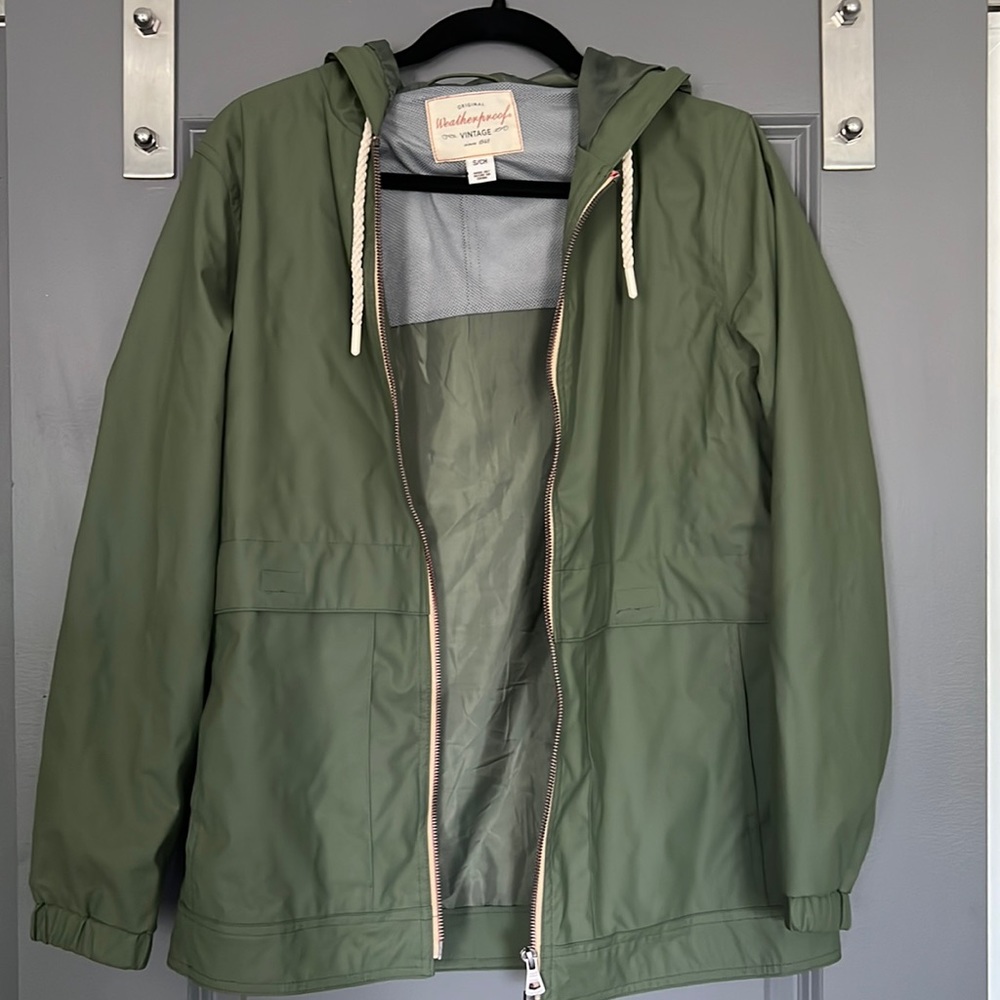 Never worn Weatherproof women’s rain jacket.